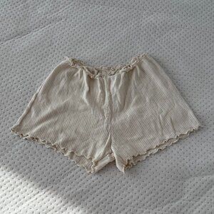 BRANDY MELVILLE CREAM RIBBED RUFFLE LETTUCE HEM SHORTS